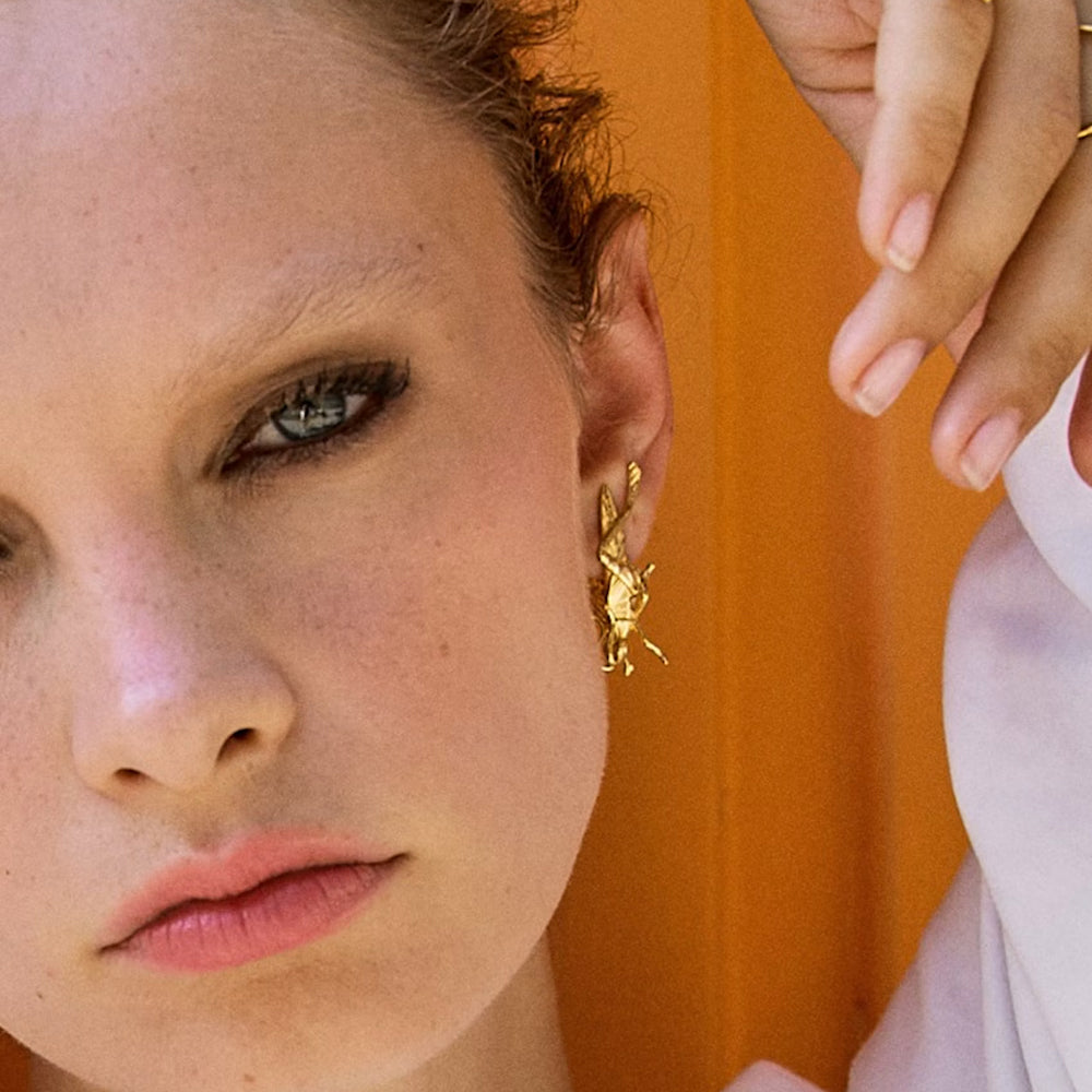 
                  
                    Dalí x Suma Cruz cricket earring
                  
                